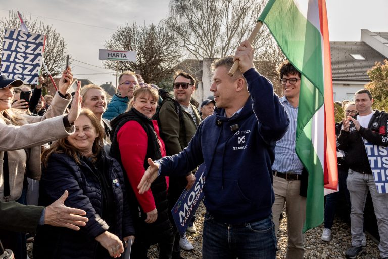 18 March 2026 Harta, Hungary. Péter Magyar, leader of the TISZA party, during a meeting with voters. Each meeting begins with Péter Magyar walking through the crowds of supporters carrying the Hungarian flag.