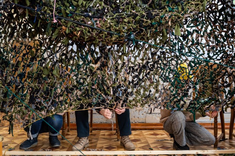 13 March 2022, Lviv, Ukraine. Volunteers weave camouflage nets for the Ukrainian army. Some of the people working here are refugees from eastern Ukraine, where the fiercest fighting is taking place.