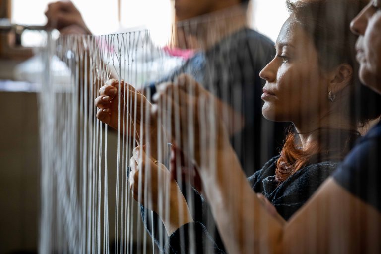 13 March 2022, Lviv, Ukraine. Volunteers weave camouflage nets for the Ukrainian army. Some of the people working here are refugees from eastern Ukraine, where the fiercest fighting is taking place.